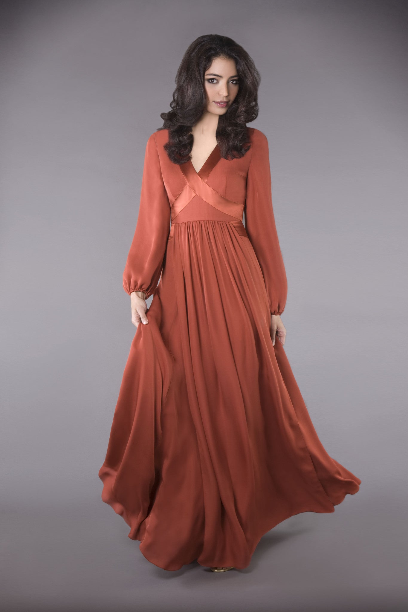 100% silk gown, long billowing sleeves, elegantly crisscrossed V-neckline, falls into a graceful hem sweep. Modest and classic