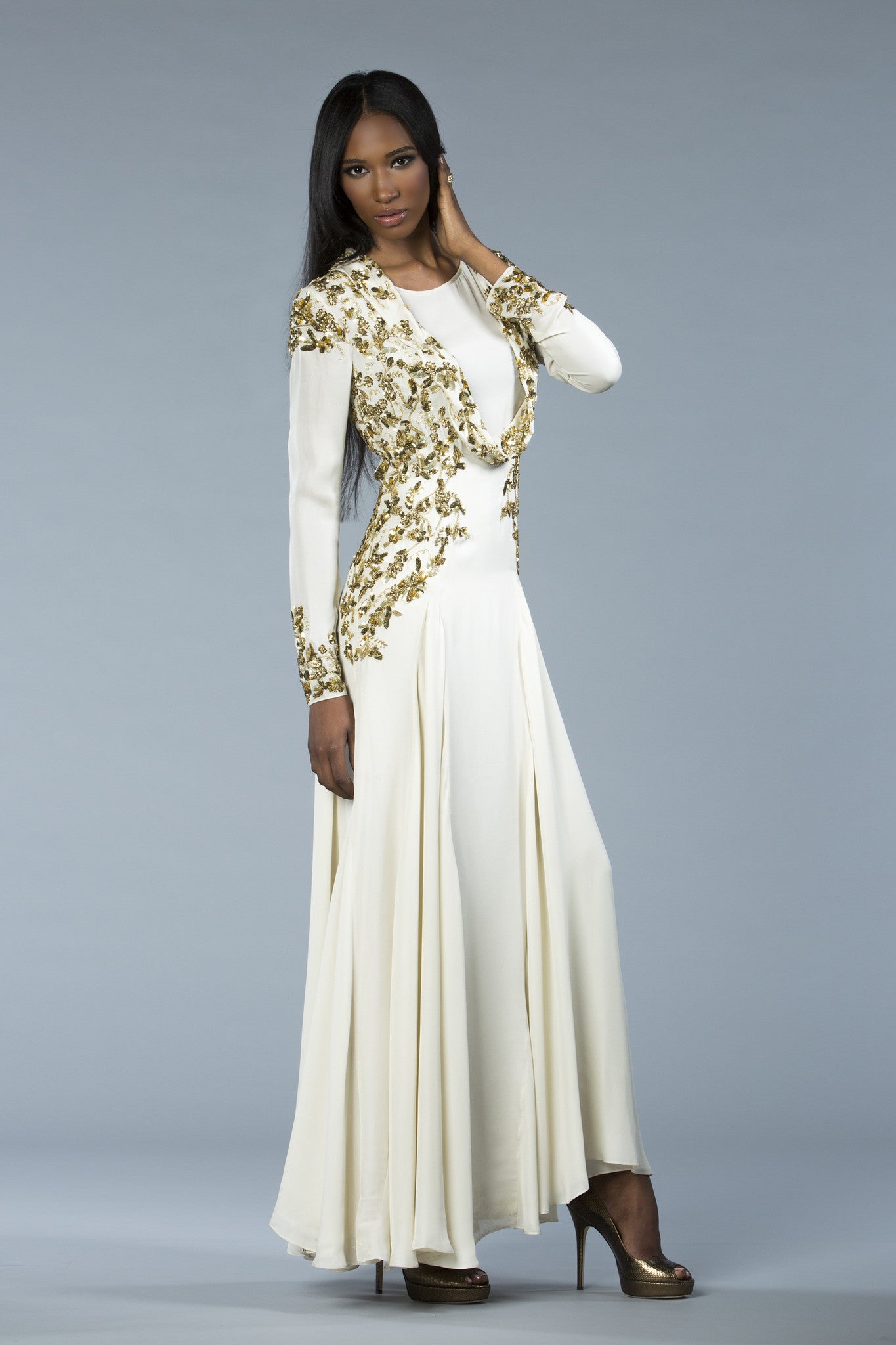 Long flowing modest gown with figure contouring hand embroidered antique gold metallic thread, sequin, bead and stone. Bridal and evening wear 